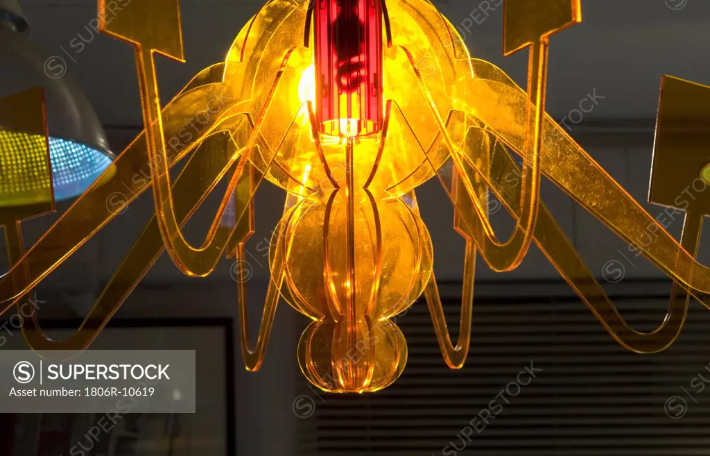 Yellow glass chandelier with track lighting. 02/17/2006