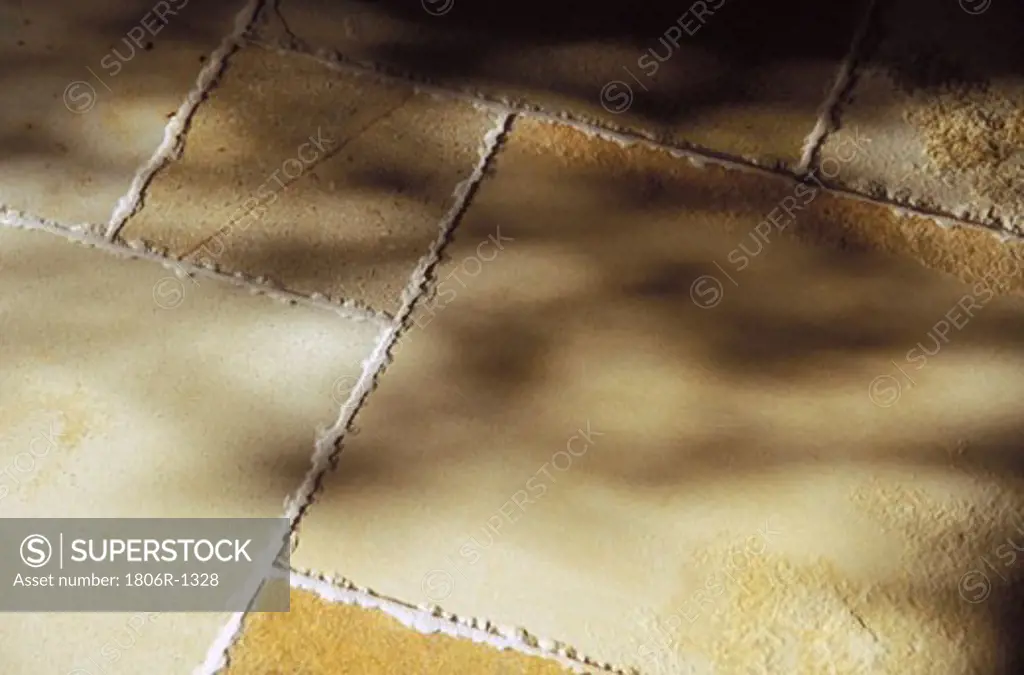 Shadows on Stone Tile Floor