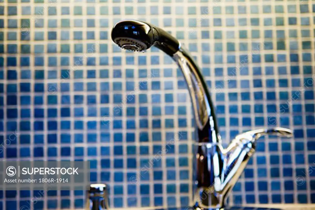 Kitchen Faucet and Blue Tiled Backsplash