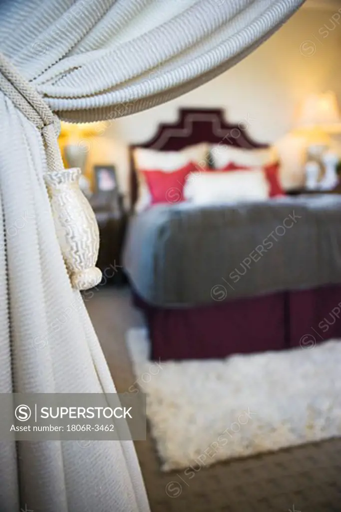 Knotted Rope and Tassels Holding White Curtain Open