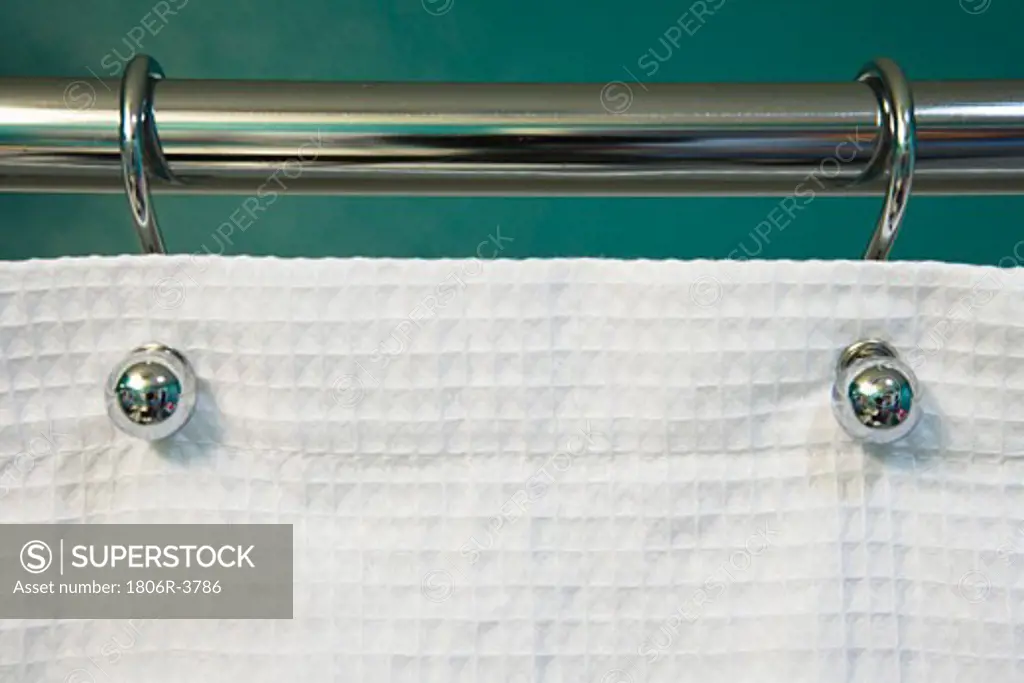 Teal Wall and Curtain Rod Holding White Shower Curtain