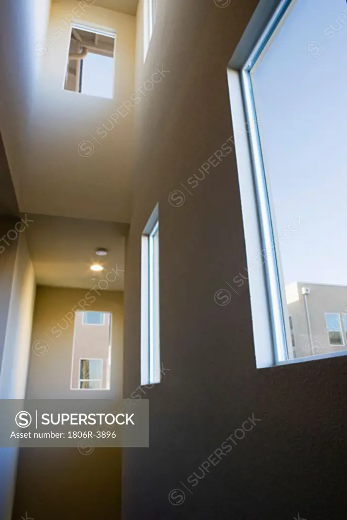 Dark Stairwell with High Ceilings and Windows