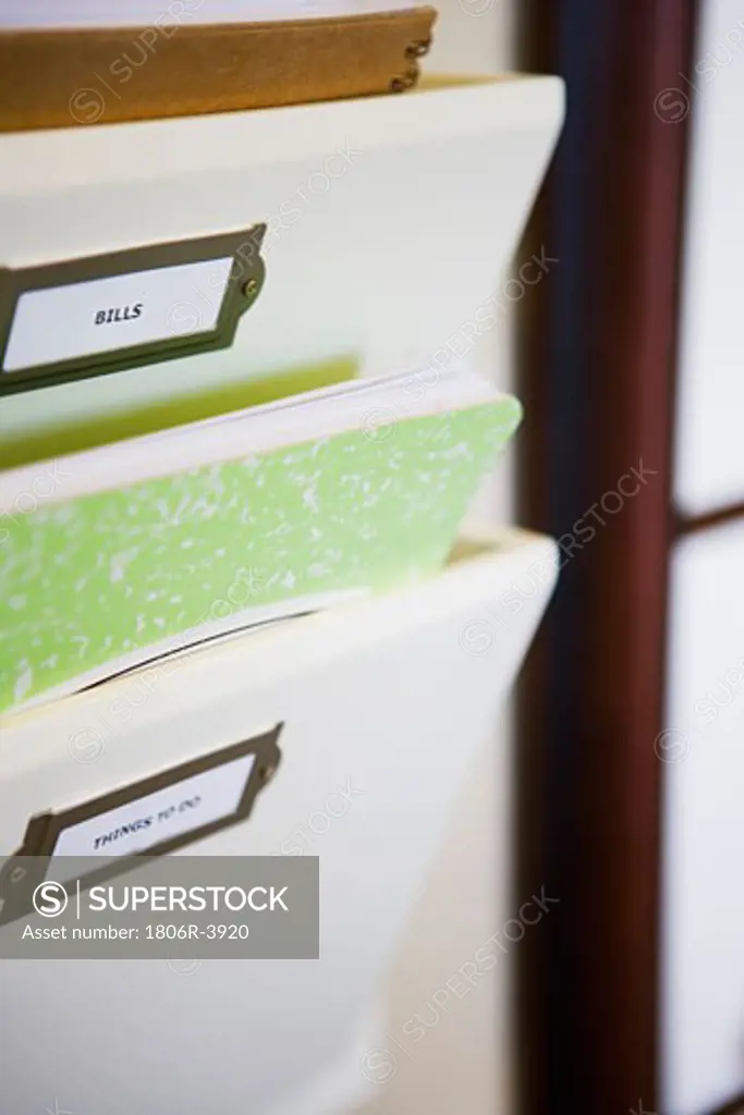 Wall Mounted File Organizer with Green Notebook