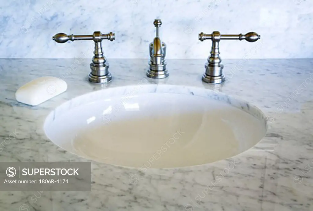 Marble Countertop with Chrome Faucet and Bar of Soap