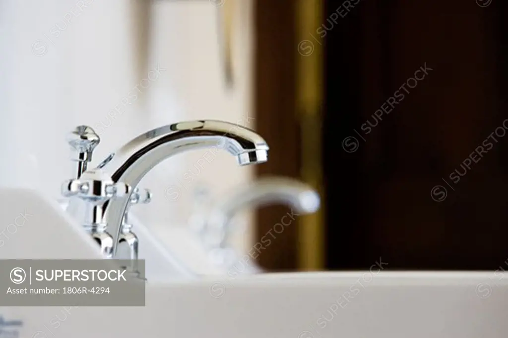 Side view of White Sink and Chrome Faucet