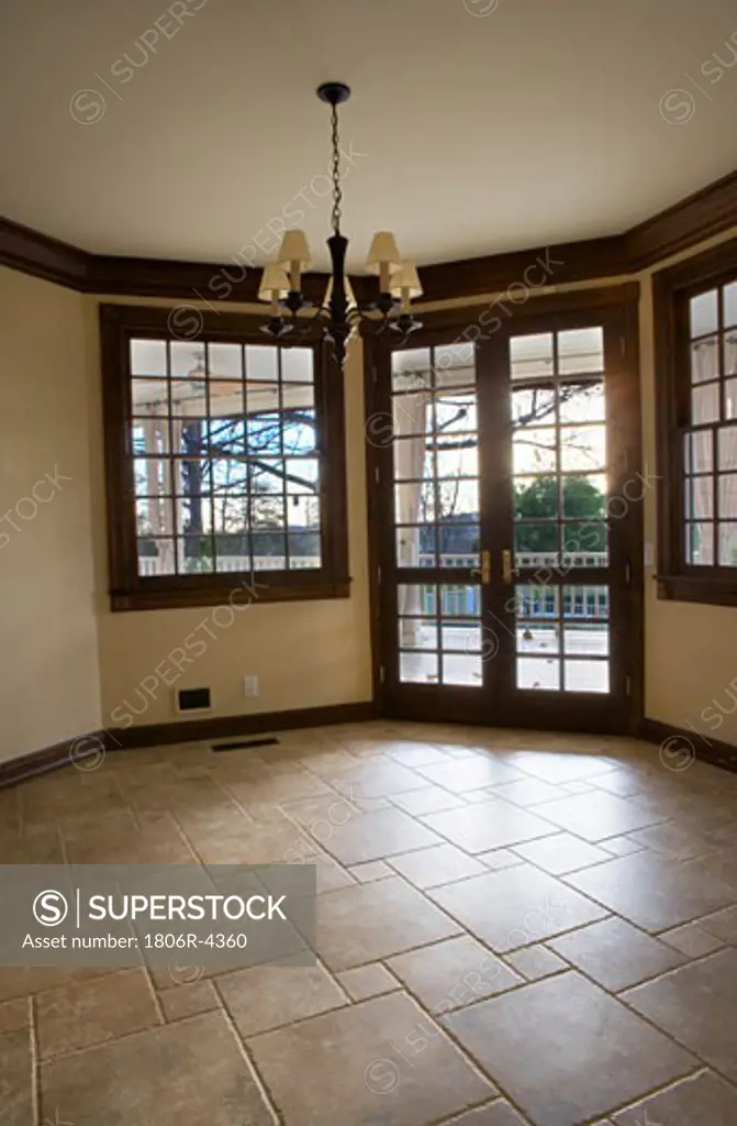 Empty Room with Tile Floor and French Doors