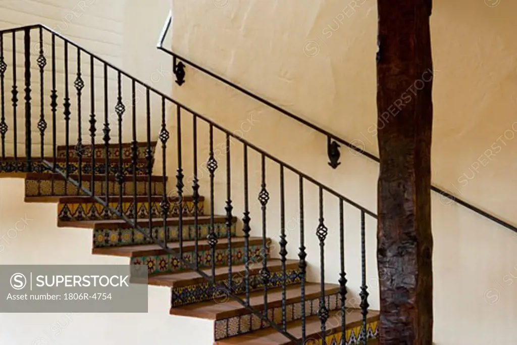 Spanish Style Stairway with Wrought Iron Bannister