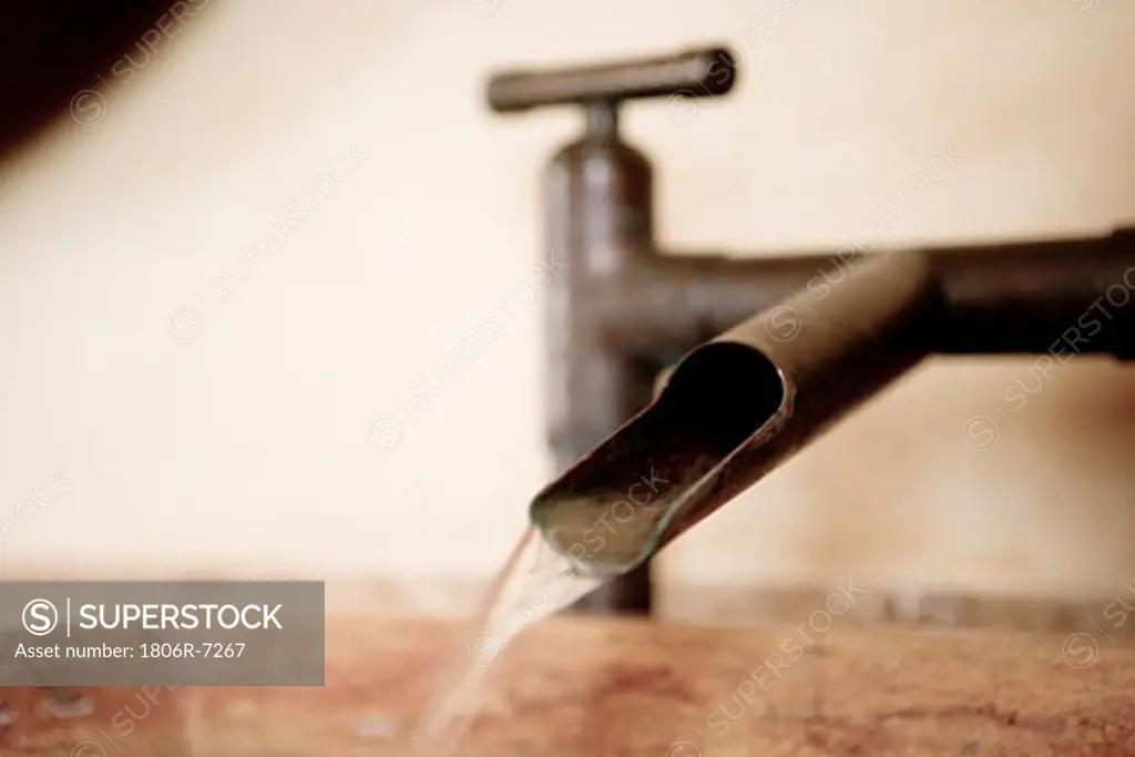 Detail of modern running faucet