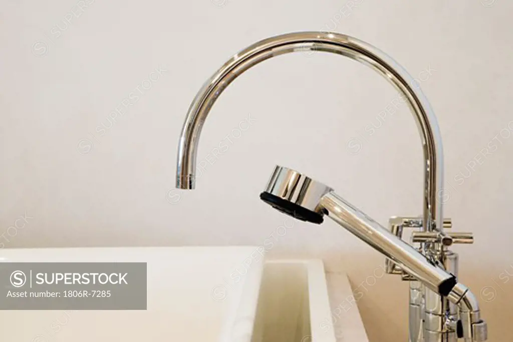 Detail of a modern chrome faucet