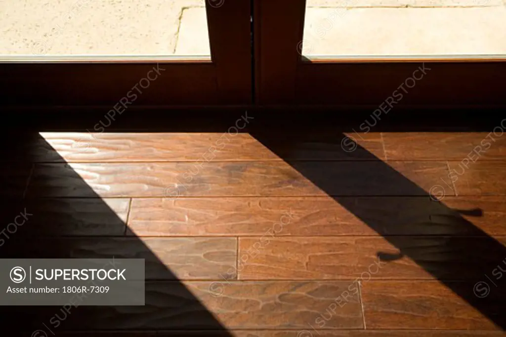 Window light across a hardwood floor
