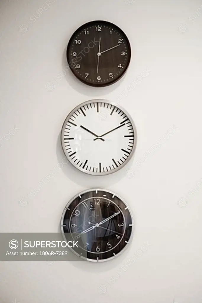 Three clocks on a wall