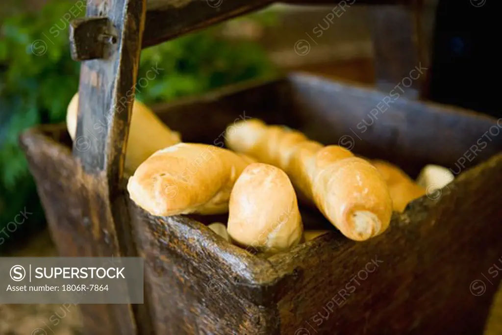 Detail breadsticks in wooden bread basket