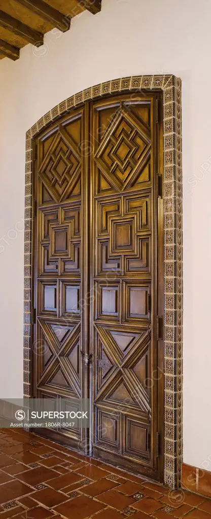 Detail ornate wooden double doors, panoramic