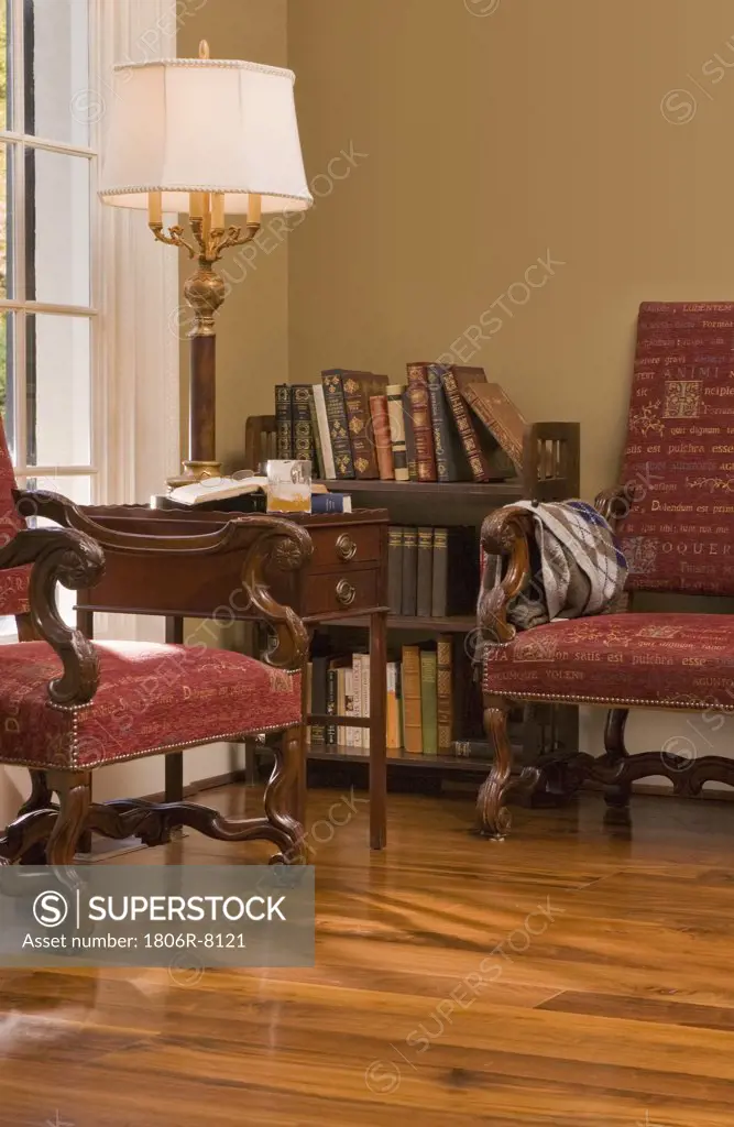Sitting area with two armchairs and cherry hardwood floors