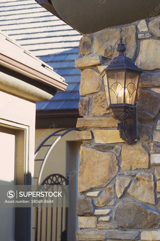 Wall sconce on exterior stone wall