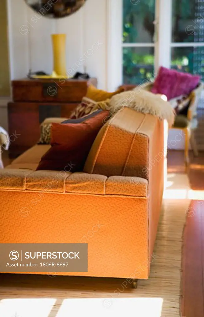 End of contemporary orange sofa