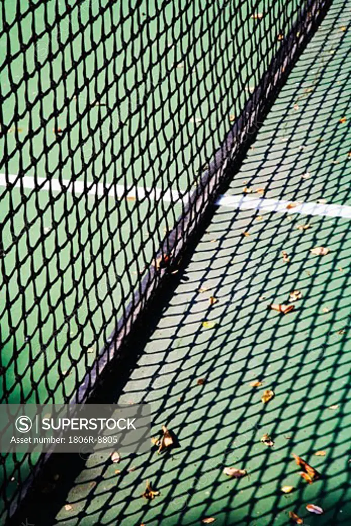 Detail of net and shadow on tennis court