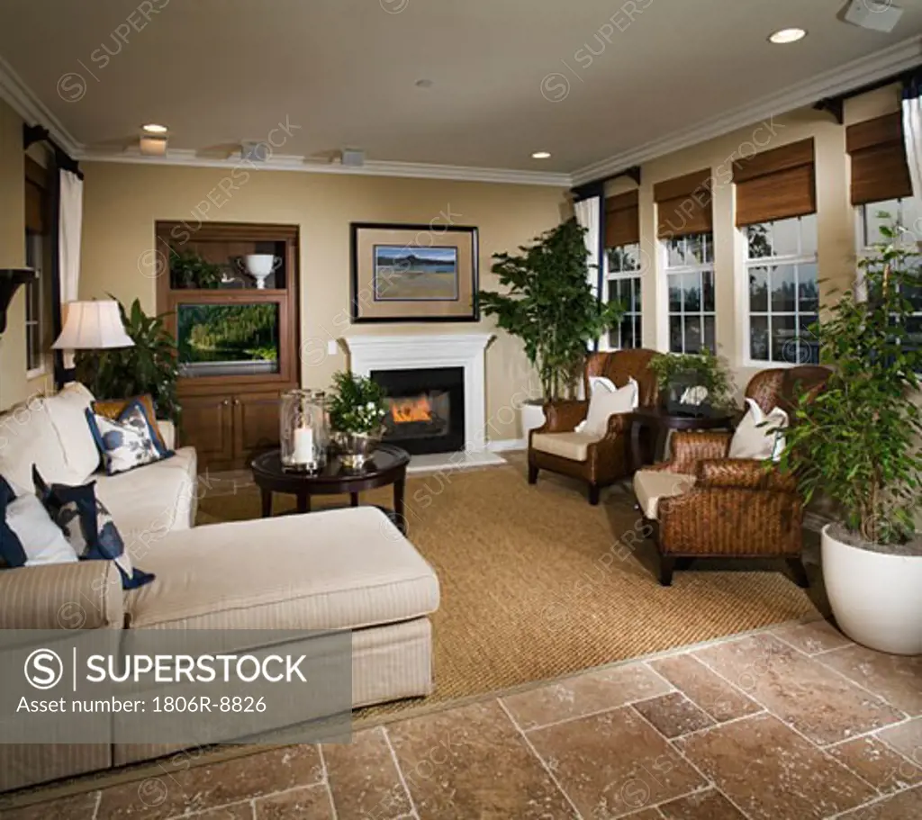 Sitting room with fireplace and television
