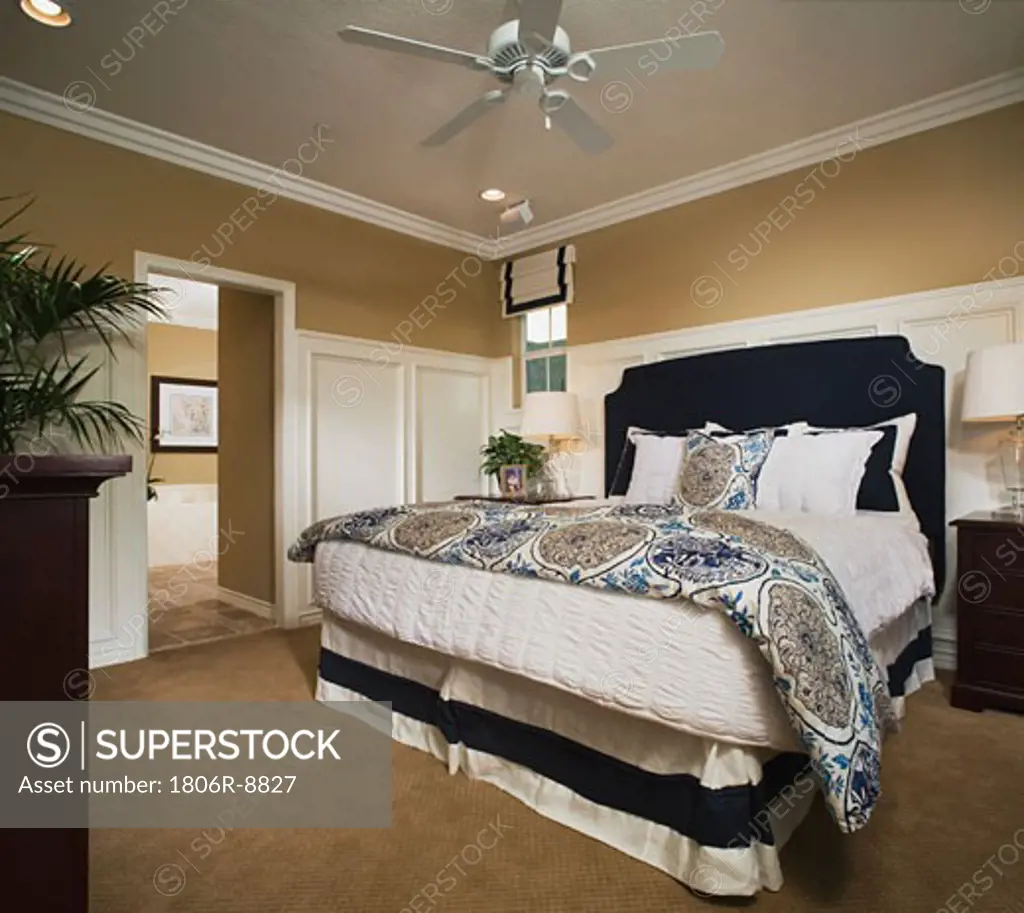 Master bedroom with wainscoting and crown molding