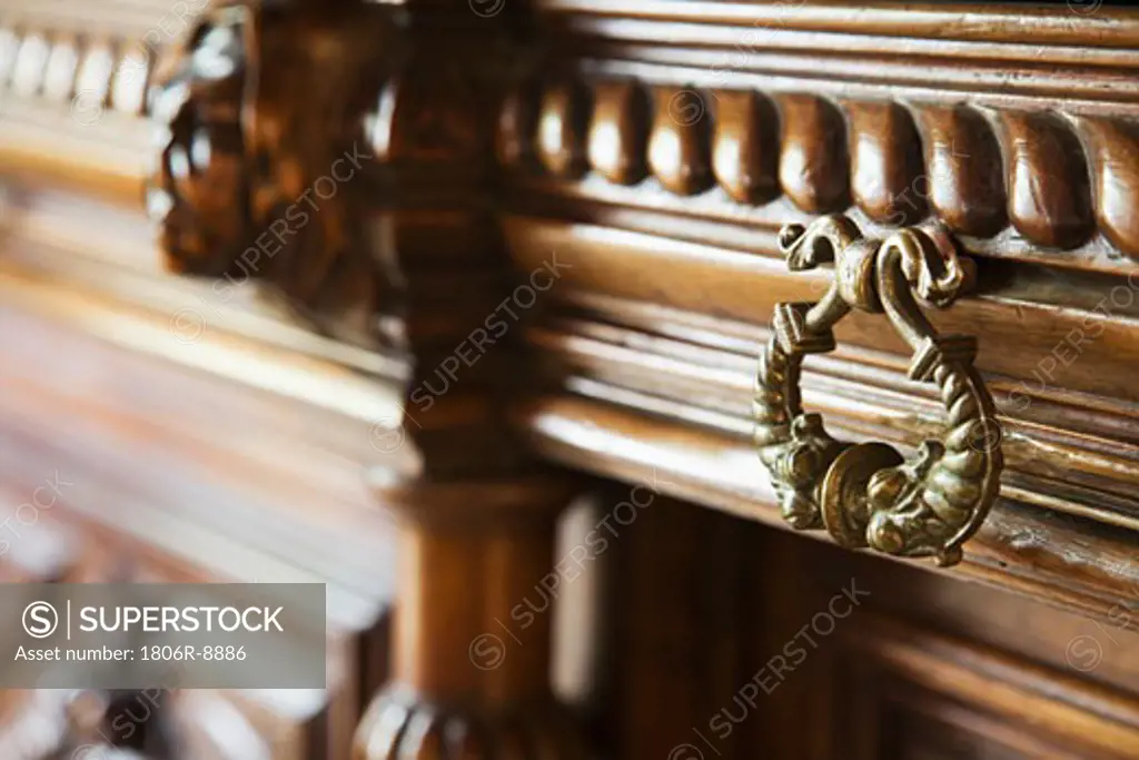 Bronze drawer handle on wooden drawer
