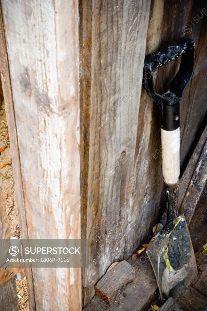 Shovel against Wood Fence