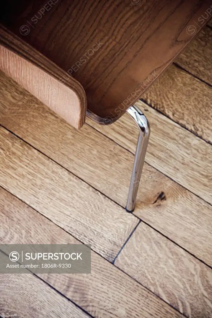 High angle wooden chair detail on hardwood floor