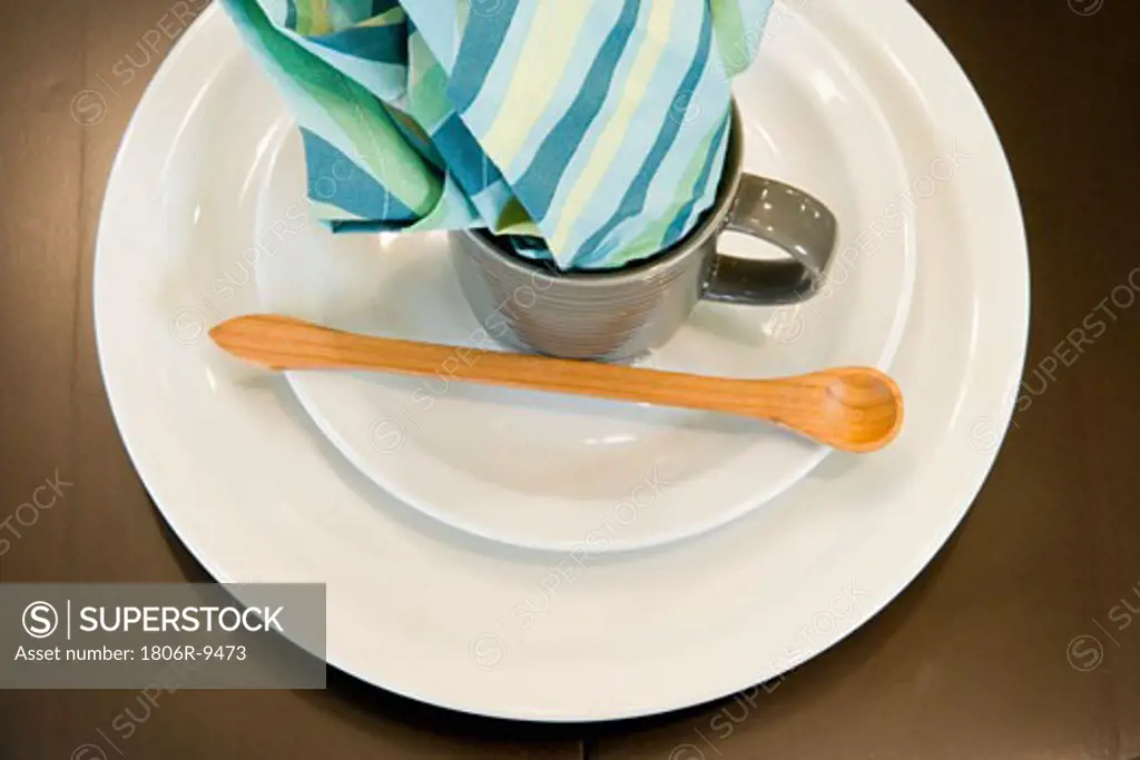 Simple place setting with wooden spoon