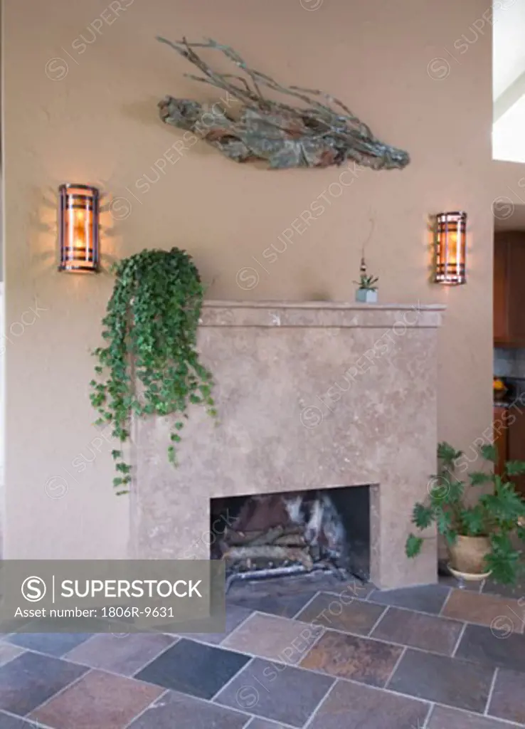 Outdoor fireplace with wall lighting