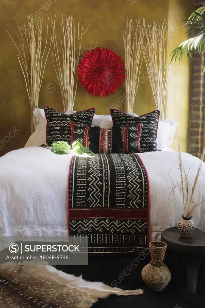 Black, white and red decorative pillows and bed runner