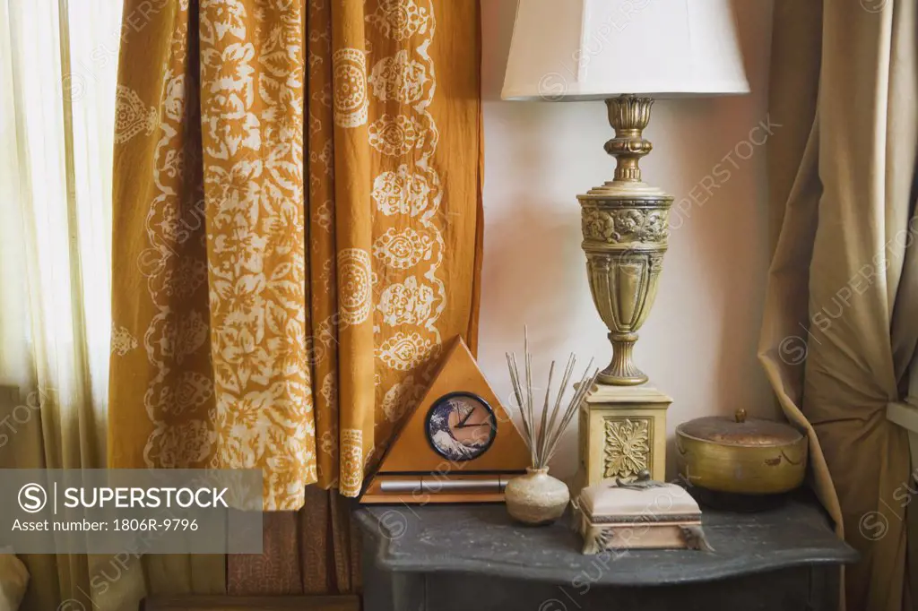 Eclectic Side Table with Lamp and Clock