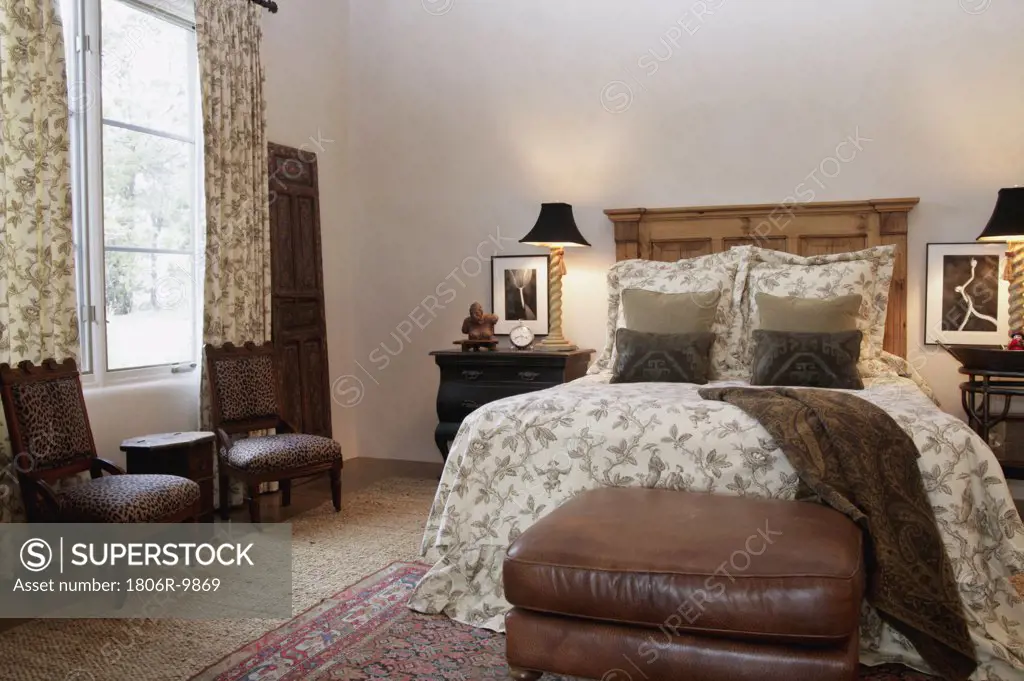 Sitting area and bed in traditional bedroom