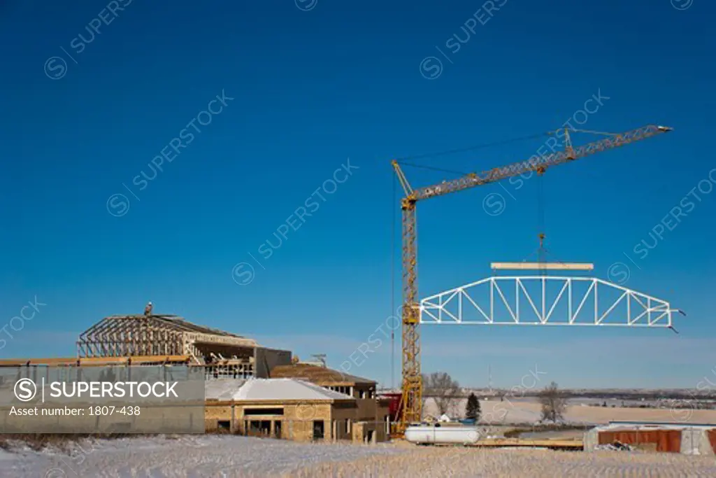 Crane lifting wooden frame