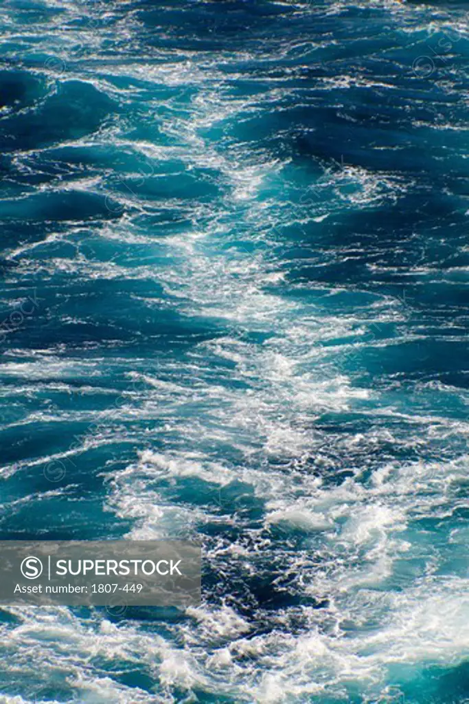 Blue sea with prop wash wake