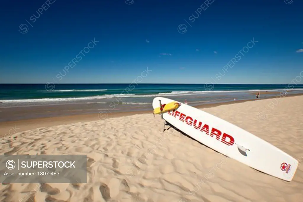 Australia, Gold Coast, Surfers Paradise, Lifeguard rescue surfboard on beach
