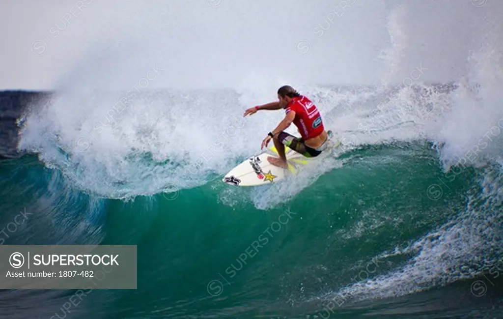 Surfer races at the Quiksilver and Roxy Pro World Title Event, Snapper Rocks, Gold Coast, Australia