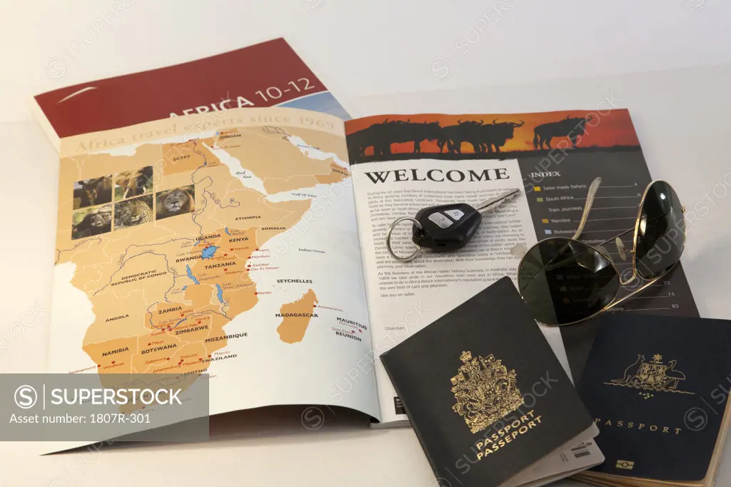 Map and car key with two passports