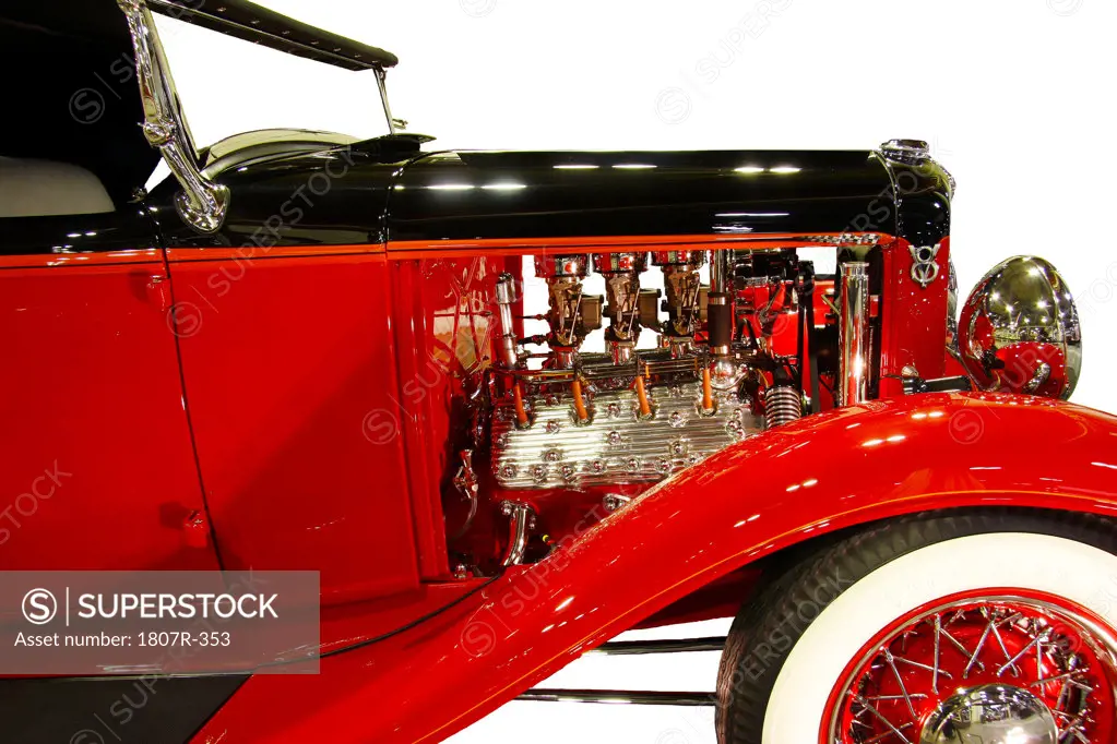 Side view of red vintage car