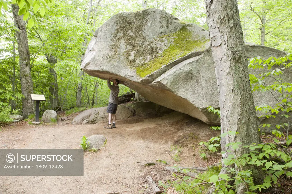 Franconia Notch State Park...Boise Rock during the spring months. Located in Franconia, New Hampshire USA... Folklore is that Thomas Boise spent the night under the overhang of this boulder during a blizzard in the 1800's