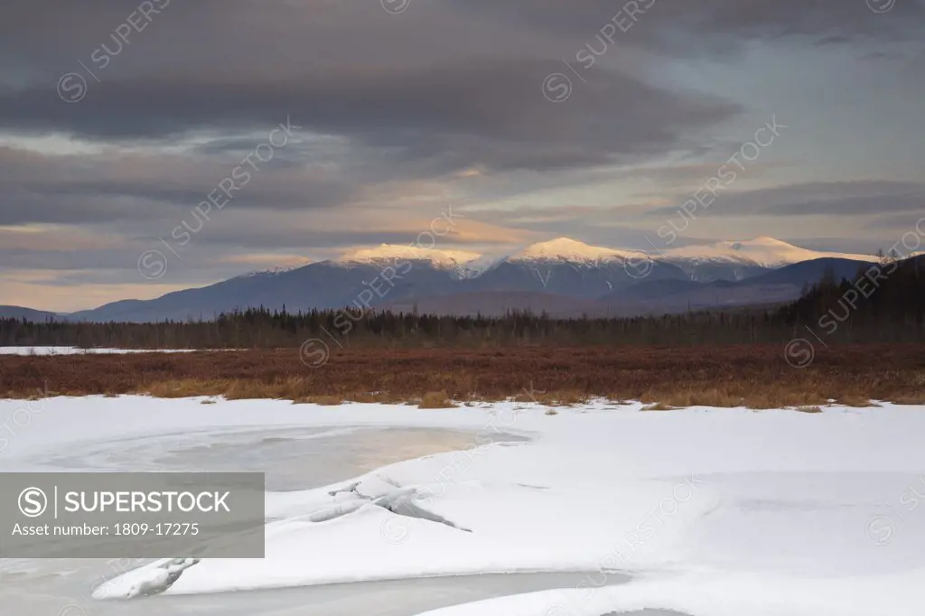 Pondicherry Wildlife Refuge - Scenic view of Presidential Range at sunset from from Cherry Pond in Jefferson, New Hampshire USA during the winter months