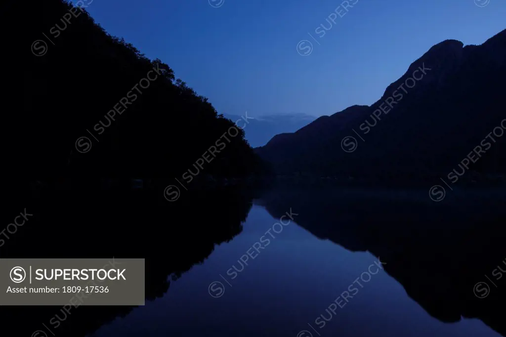 Franconia Notch State Park - Silhouette of Eagle Cliff at twilight from Profile Lake in the White Mountains, New Hampshire USA during the summer months