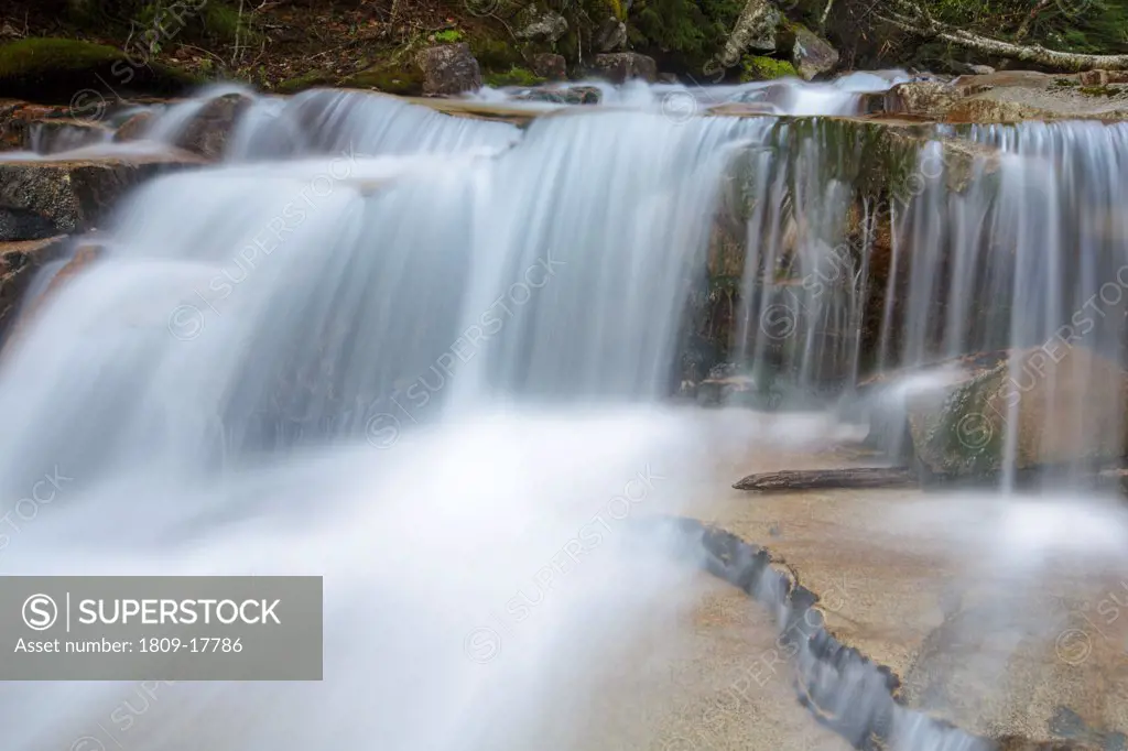 Walker Cascades during the spring months. These cascades are located along Walker Brook in Franconia Notch State Park of the White Mountain National Forest, New Hampshire