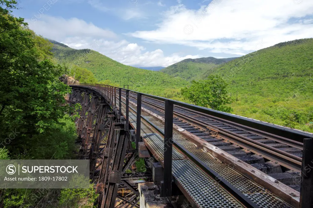 Crawford Notch State Park - Frankenstein Trestle  along the Maine Central Railroad in the White Mountains, New Hampshire USA. Chartered in 1867 as the Portland & Ogdensburg Railroad Company then leased to the Maine Central Railroad in 1888 and later abandoned in 1983. Since 1995 the Conway Scenic Railroad, which provides passenger excursion trains has been using the track