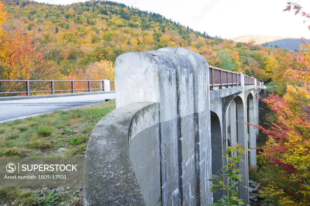 Franconia Notch State Park - The old U.S. Route 3 bridge which crosses over Lafayette Brook in the White Mountains, New Hampshire USA during the autumn months. This bridge is closed to traffic and is part of the multi-use Franconia Notch Bike Path.