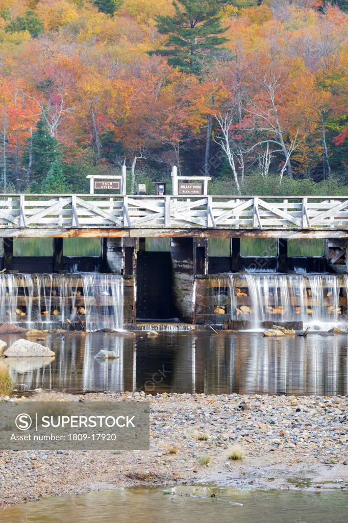 Crawford Notch State Park - Reflection of dam along the Saco River at the Willey House Historical Site in the White Mountains, New Hampshire USA during the autumn months