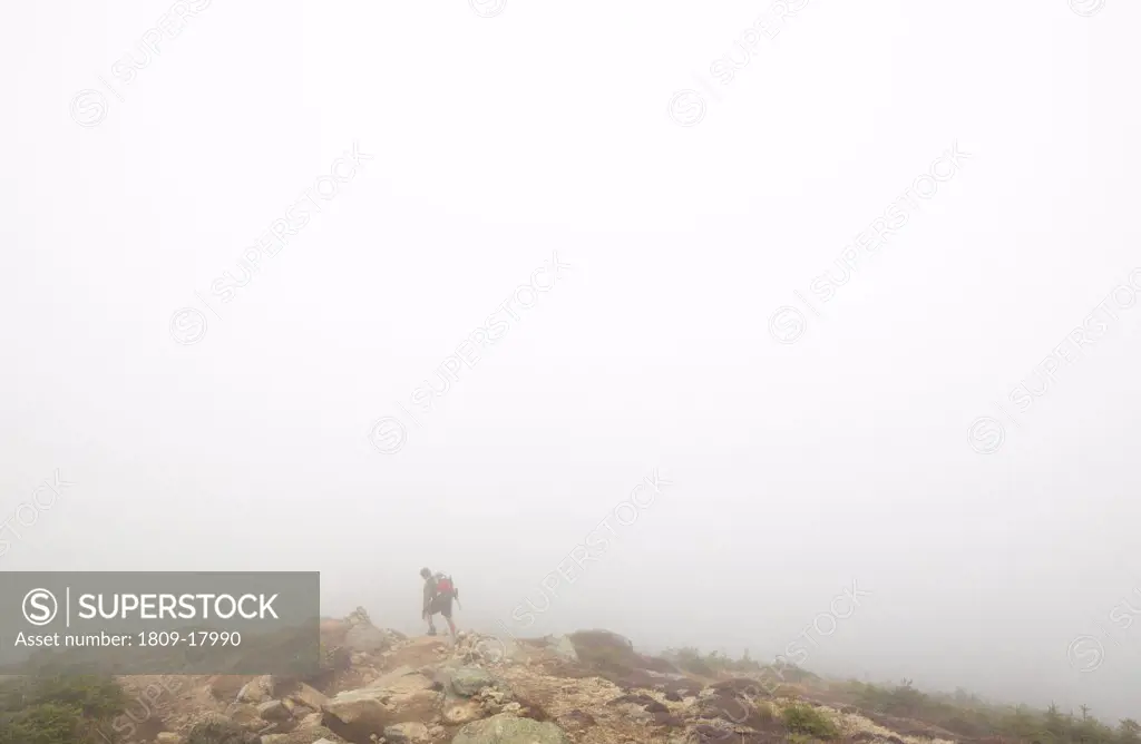 Foggy conditions along the Appalachian Trail near summit of Mount Lincoln (Franconia Ridge Trail)  in the White Mountains, New Hampshire USA during the autumn months