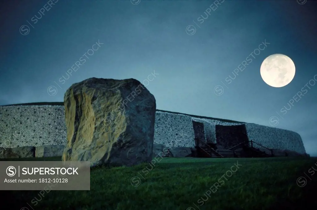 Newgrange, Co Meath, Ireland, View of the burial chamber at standing stone at night