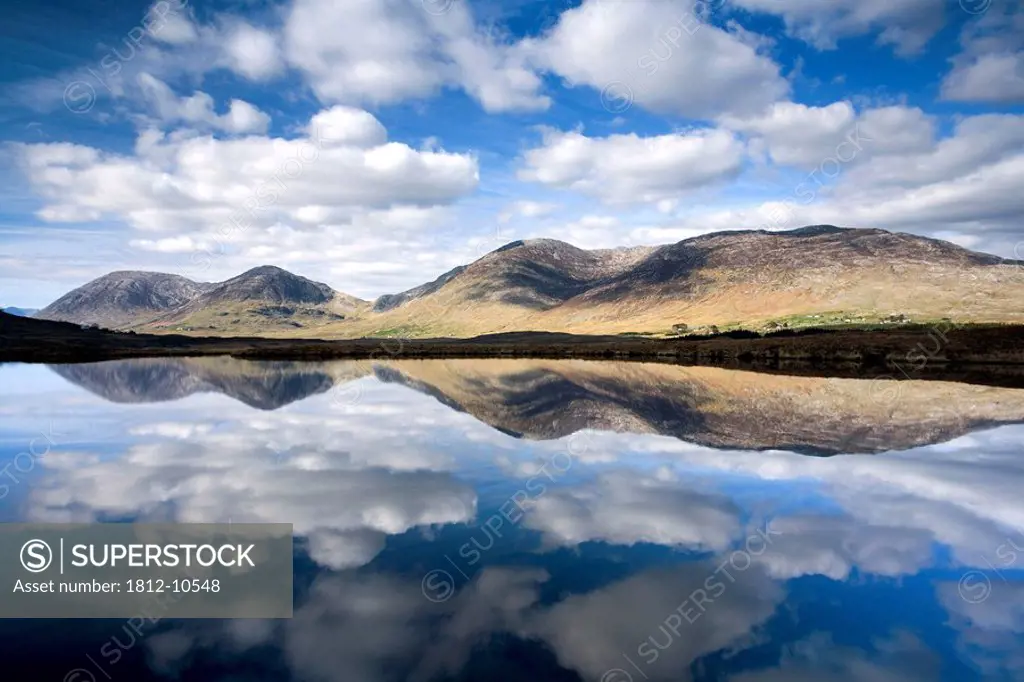 Maumturks, Co Galway, Ireland, Lake surrounded by a mountain range