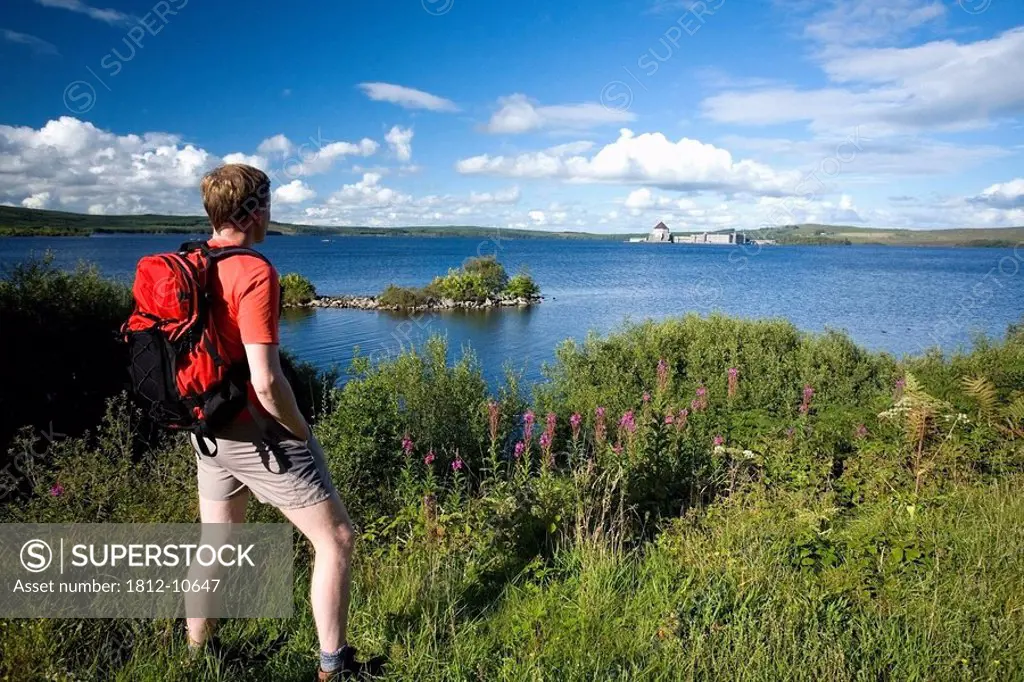 Station Island, Co Donegal, Ireland, Person looking across Lough Derg to St Patrick´s Purgatory