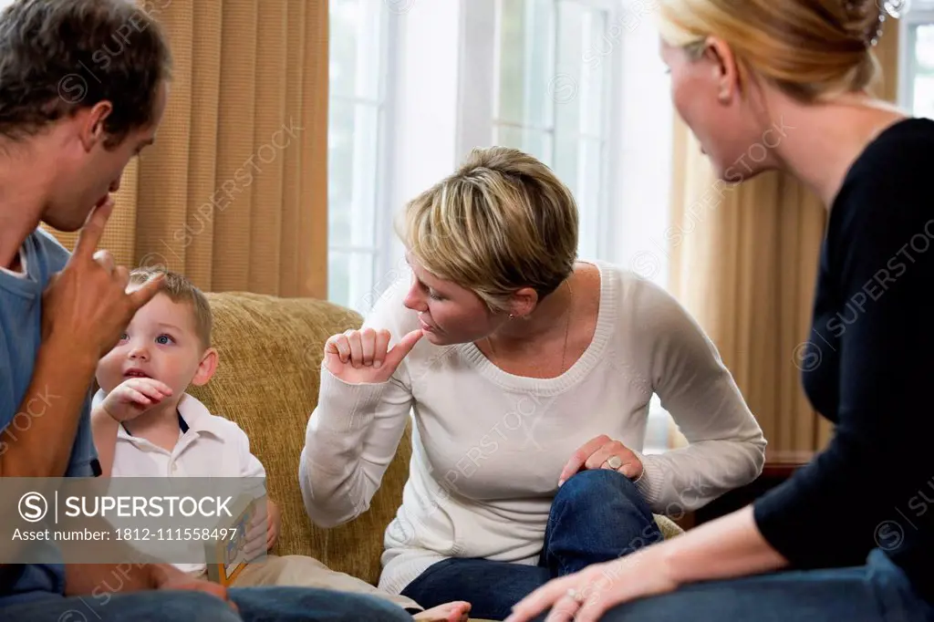 Family conversing in sign language