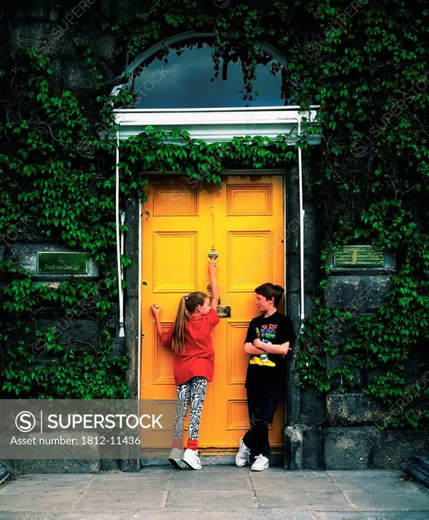 Boy And Girl Standing By A Door, Merrion Square, Dublin, Co Dublin, Ireland
